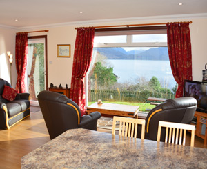 The sitting room with sea and mountain views